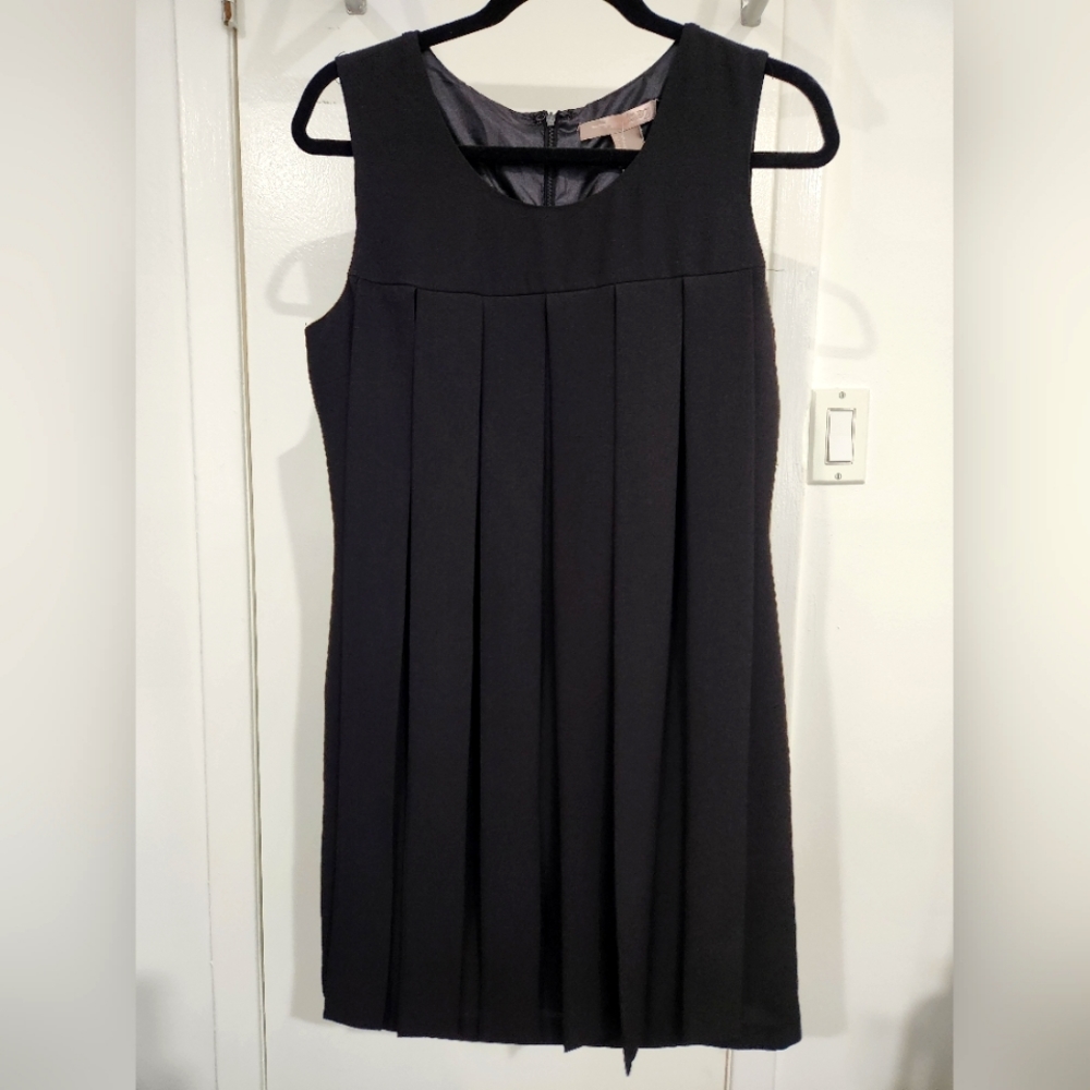 Black dress - knee length or shorter depending on height